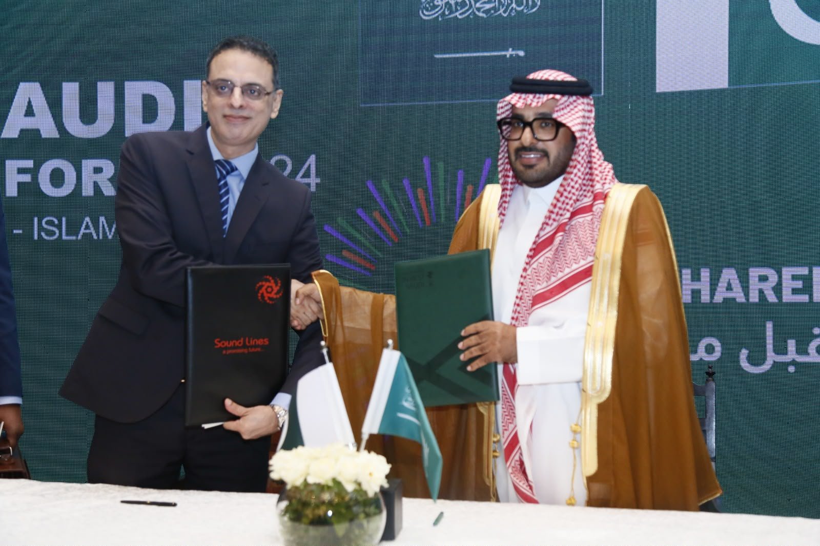 Sound Lines representative shaking hands with Saudi delegate